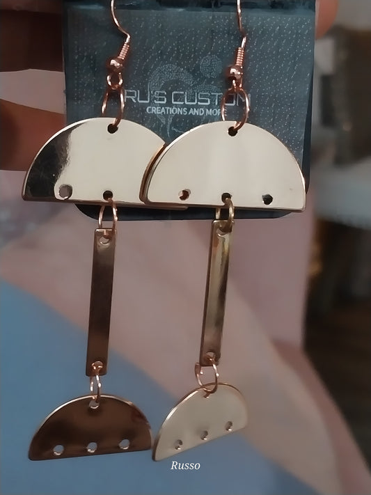 Rose gold colored eccentric earrings